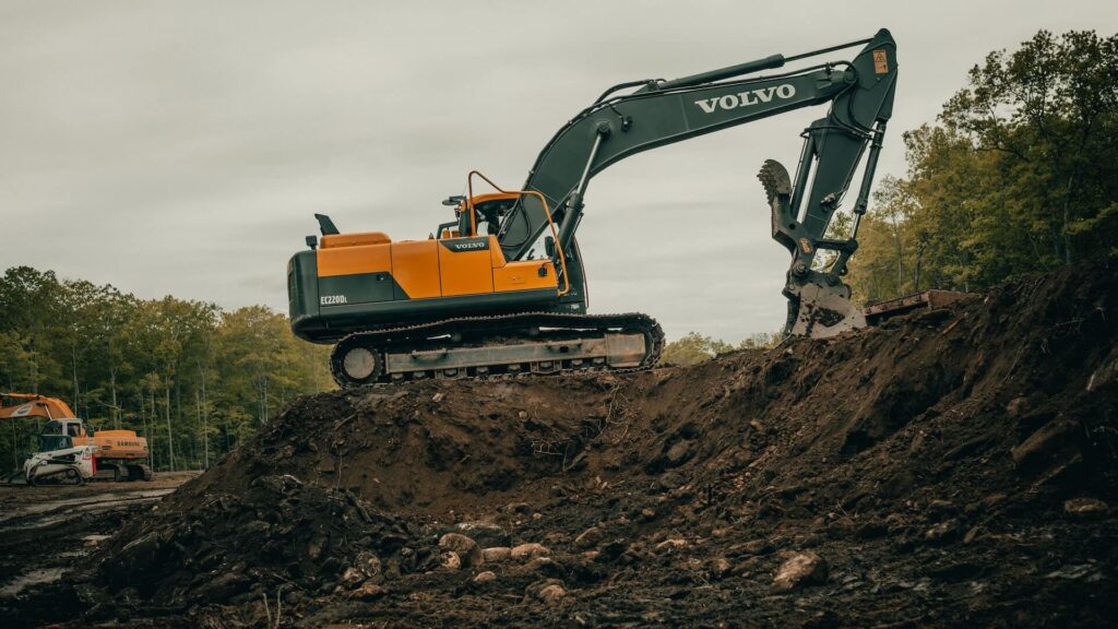 Skilled trade worker operating heavy construction equipment on jobsite